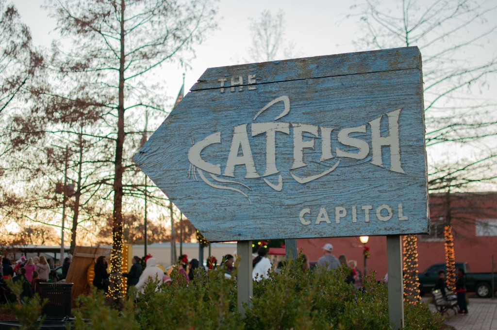 People gather for the Second Annual Christmas Tree Lighting and Christmas Farmers and Crafters Market in Belzoni, Miss., on Monday, Dec. 5, 2023.