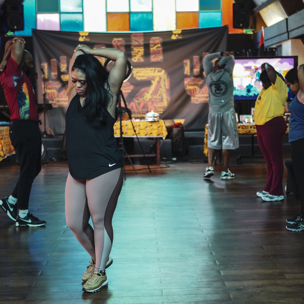 Folks stretch during an exercise session at Abyssinian Missionary Baptist Church. Photo by Sono Motoyama for MLK50