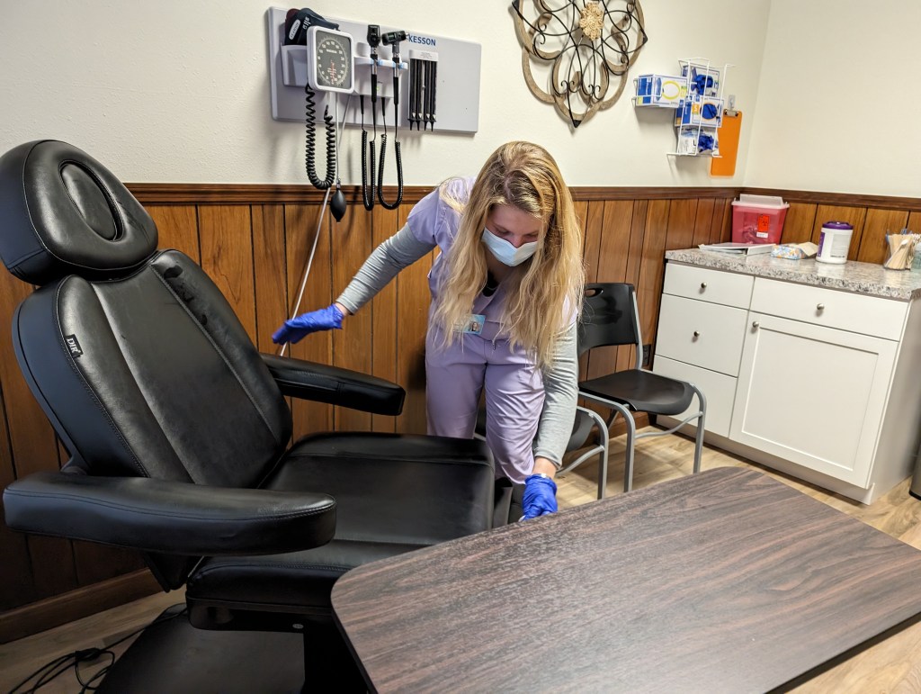 A medical assistant preps an exam room at One Health’s Powell clinic. It and other community health centers can be among the limited options available for Wyomingites in the insurance coverage gap.