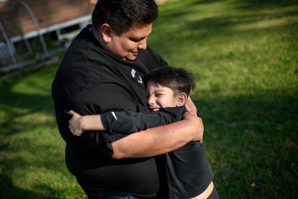 George Galindo hugs his 5-year-old son, George Junior. Having lived in Channelview for nearly 30 years, Galindo feels it's too late for him to escape the long-term effects of toxic industrial pollution.