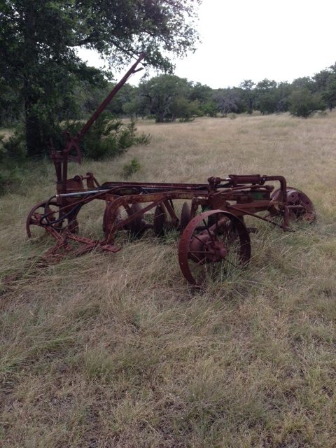 A disc plow used to prepare soil for planting crops on the author’s family farm in the Texas Hill Country.