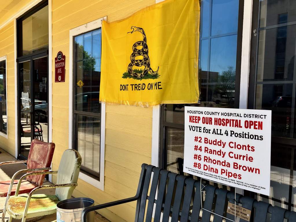 A campaign sign for the conservative slate of candidates running for the Houston County Hospital District board hangs at the Moosehead Café on the courthouse square.