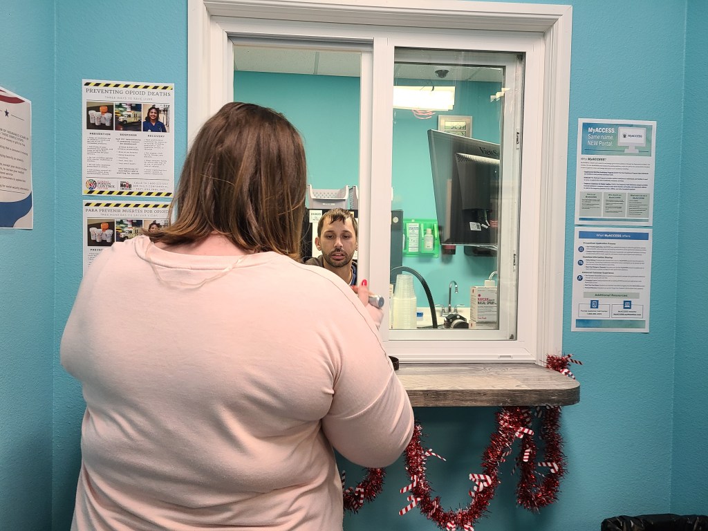 Stephanie, who asked that only her first name be used, picks up her methadone prescription at the Operation PAR clinic in Inverness in December.