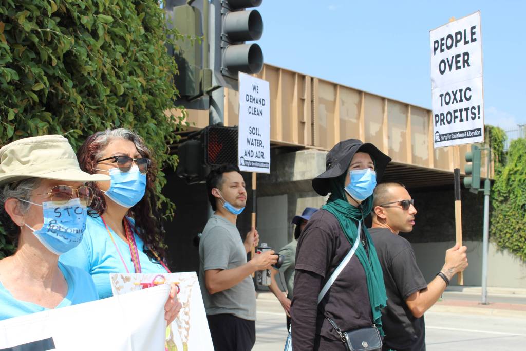 Activists from several groups, including Clean Air Coalition and Neighbors Against Phibro-Tech, joined in protest July 13 outside Ecobat along Salt Lake Avenue.