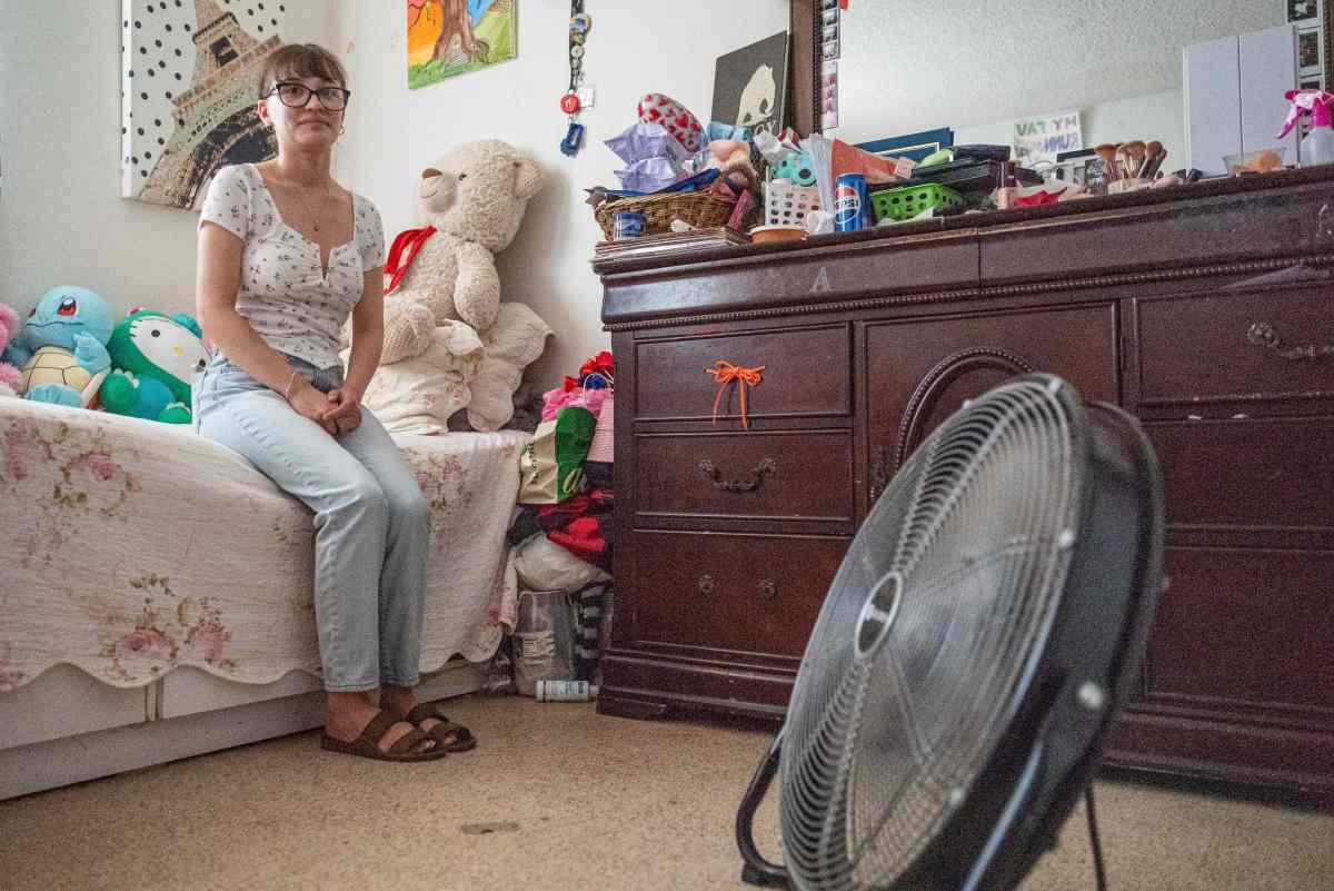 Krystal Garcia, 17, sits on her bed, which is arranged to have maximum fan exposure. Garcia’s home in Lamont relies on an evaporative cooling system.
